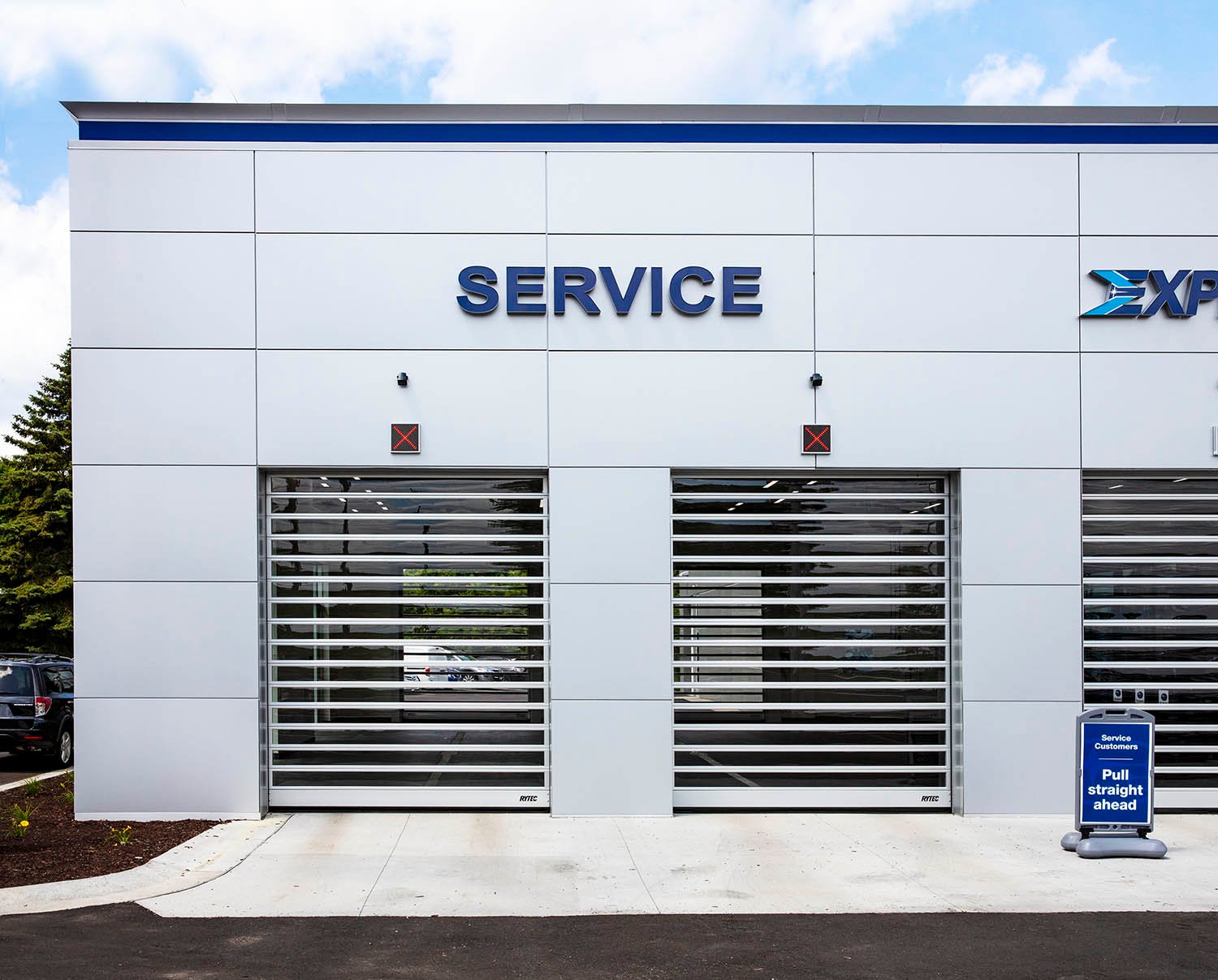 Safety Features for High-Performance Doors in Auto Dealerships