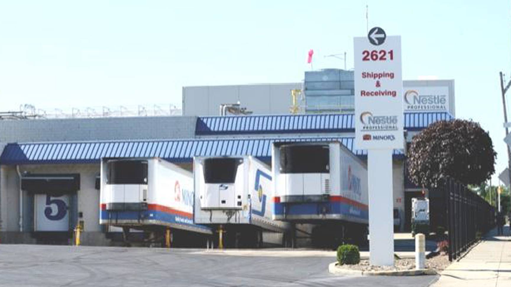 outside of MINORS with row of trucks