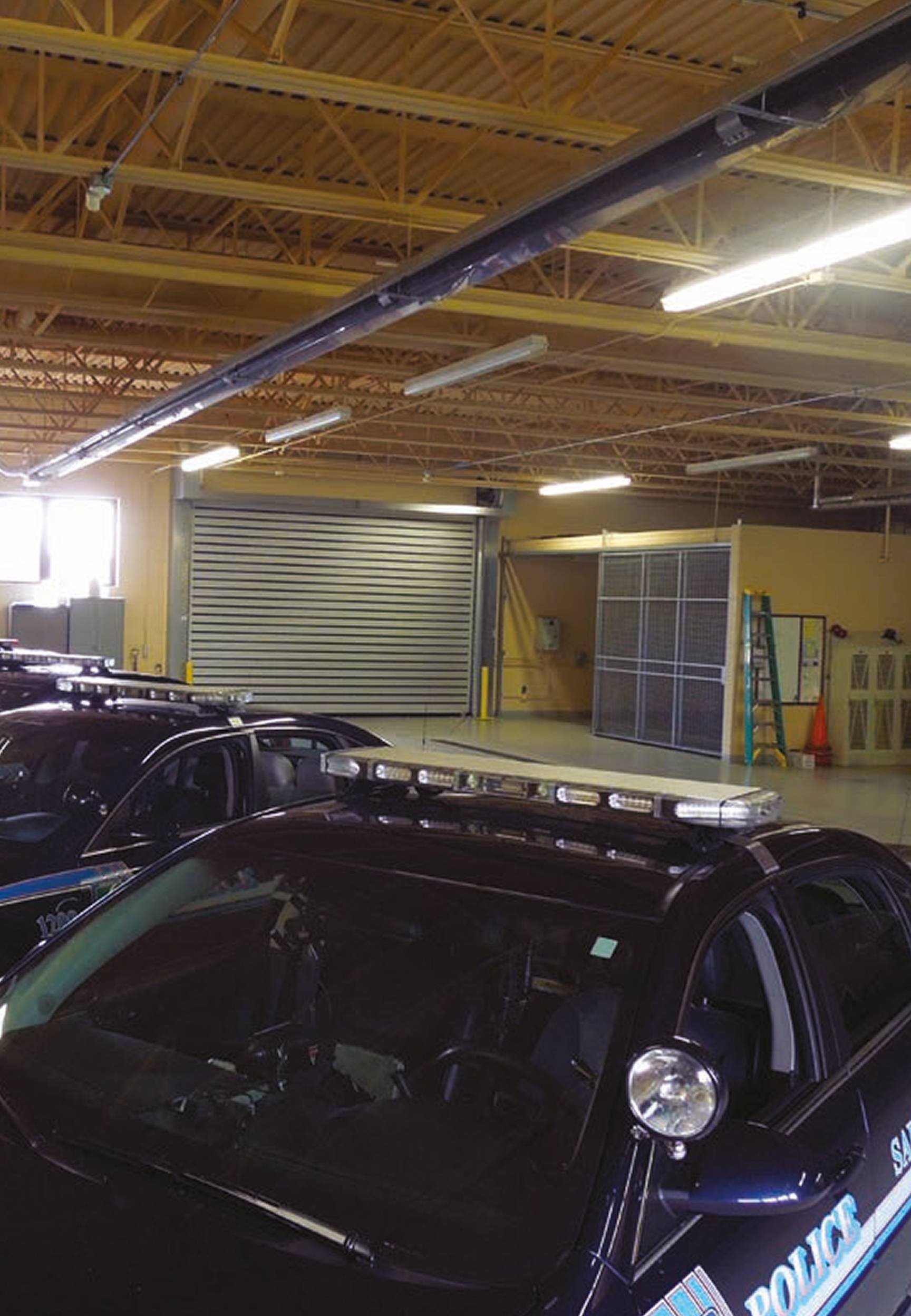 Rytec Spiral Door from inside with row of police cars