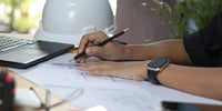 architect drafting blueprints