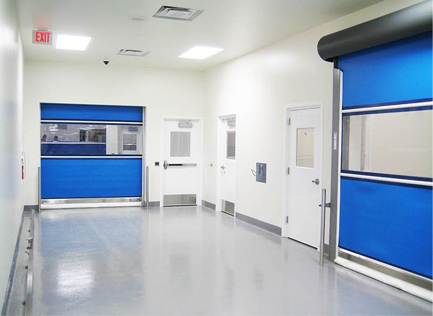 a hallway inside a pharma facility with two blue doors