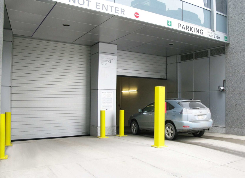 car going into parking building