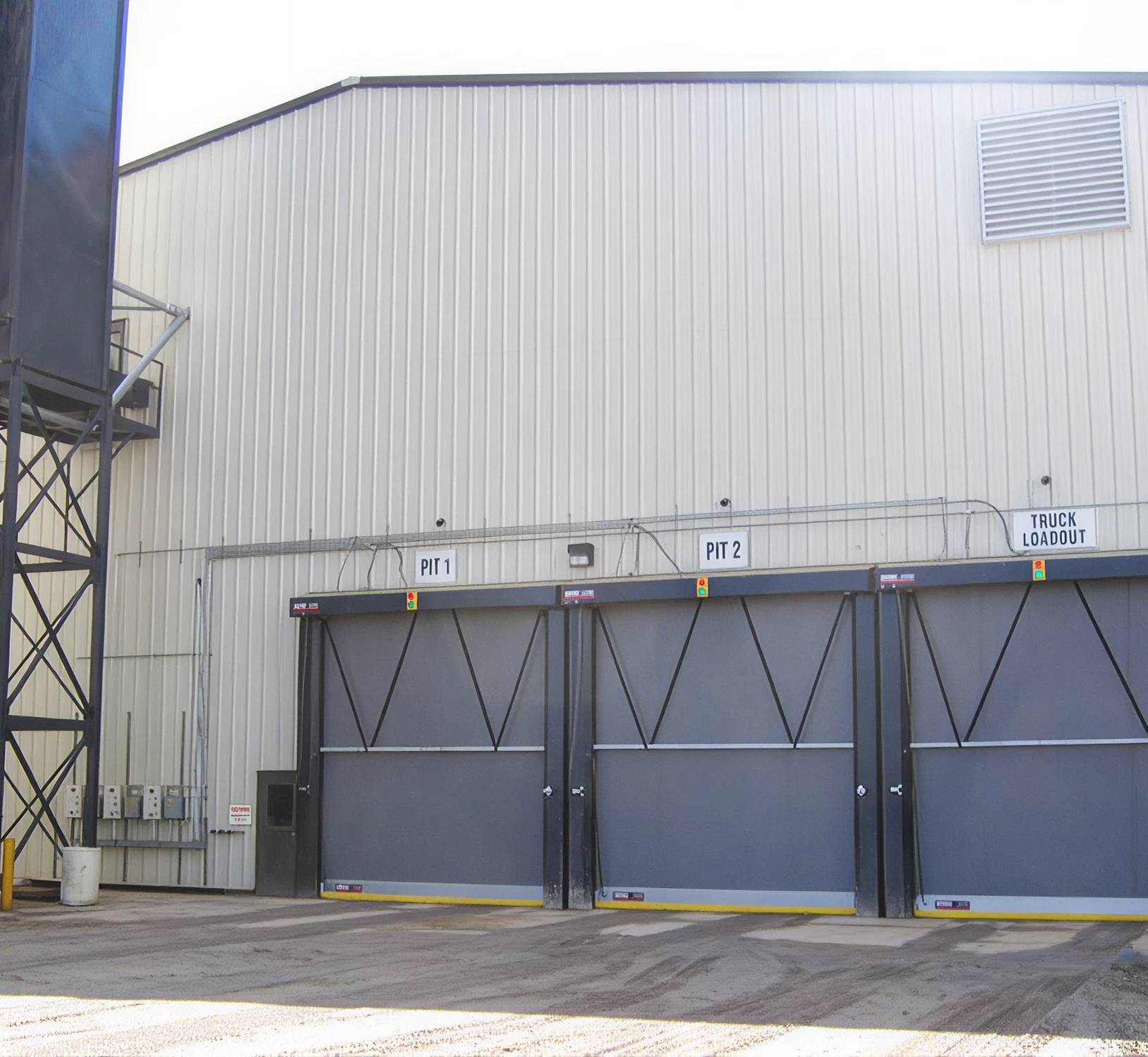 three grey doors on building exterior