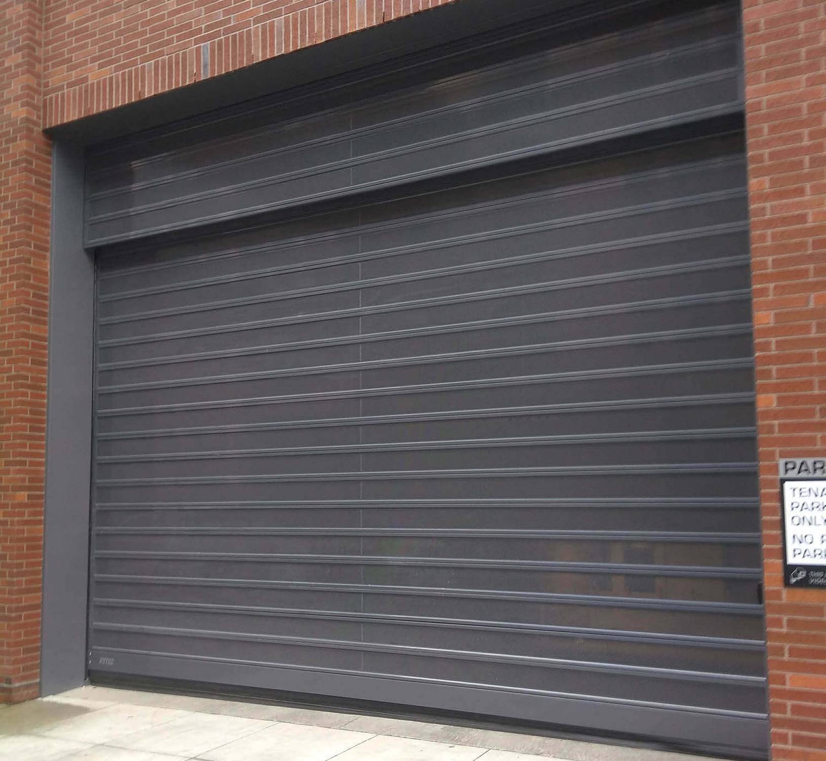 Spiral VT Parking Garage Door on Brick Building