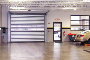 Spiral low headroom door at auto dealership