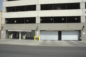 spiral rigid rolling doors on a parking garage building