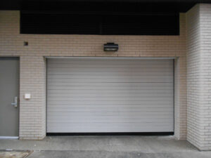 Spiral Parking Facility Doors on white brick building
